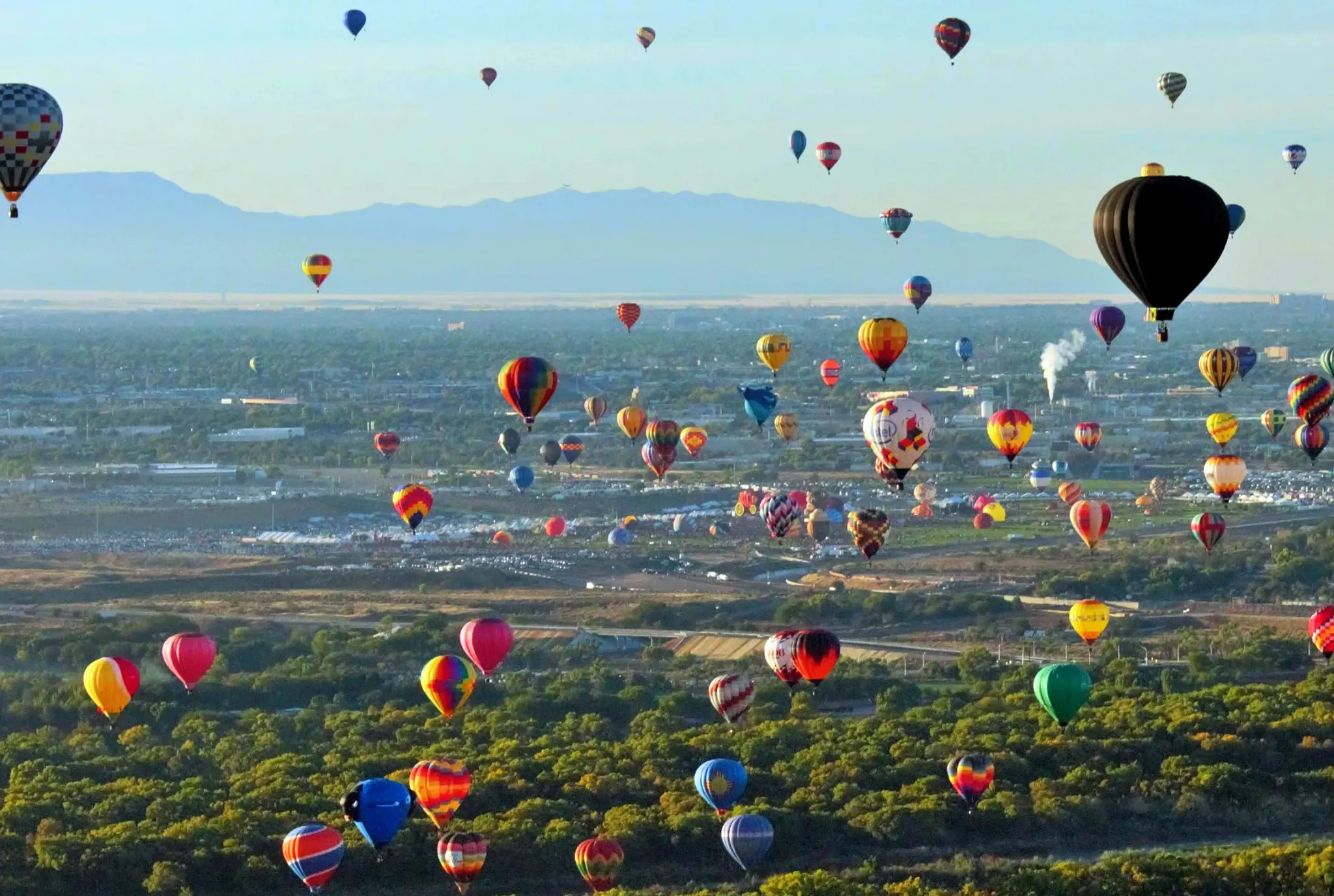 Hot air balloons over Albuquerque and the Sandia Mountains